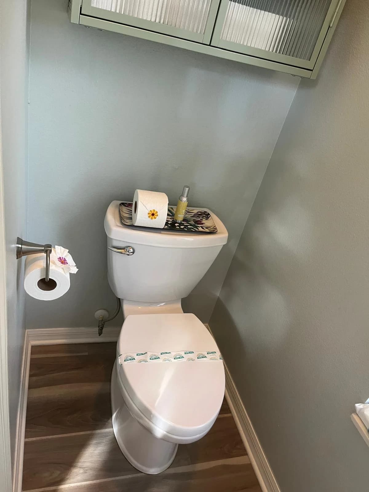 A spotless staged bathroom with fresh towels and toilet paper.